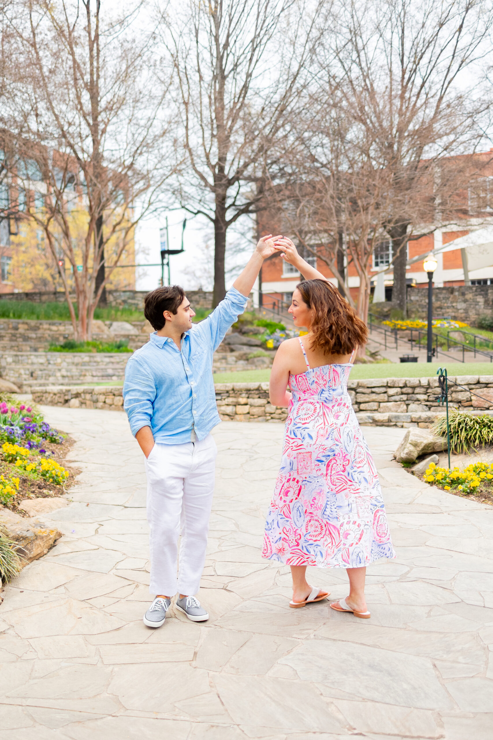couple dancing in Falls Park on the Reedy garden, holding hands